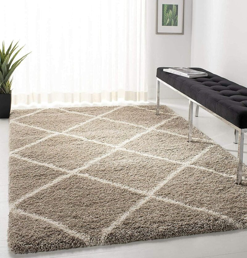 Beige Moroccan design carpet with geometric pattern, perfect for living room. Soft polyester material.