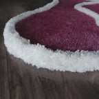 Plush rose carpet in blush pink with white 3D border, perfect for living room decor and luxury home styling.